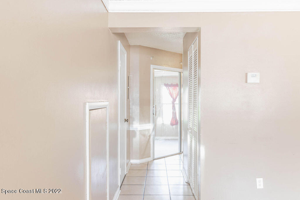 1880 Murrell Road, Unit 18 Rockledge, FL 32955 - Photo 7 of 26 a bathroom with a glass shower door