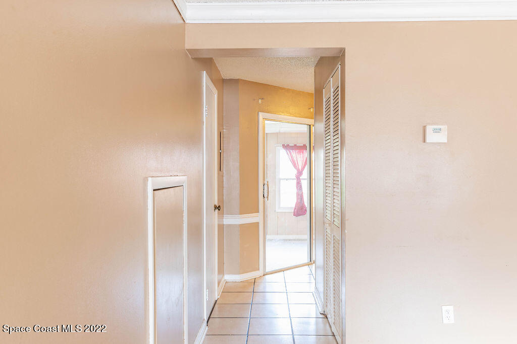 1880 Murrell Road, Unit 18 Rockledge, FL 32955 - Photo 8 of 26 a view of a bathroom from a hallway