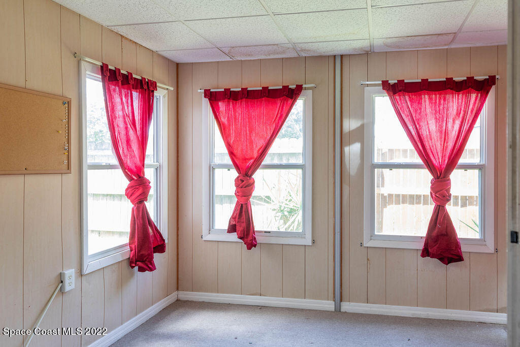 1880 Murrell Road, Unit 18 Rockledge, FL 32955 - Photo 10 of 26 a view of a room with window closet and bed