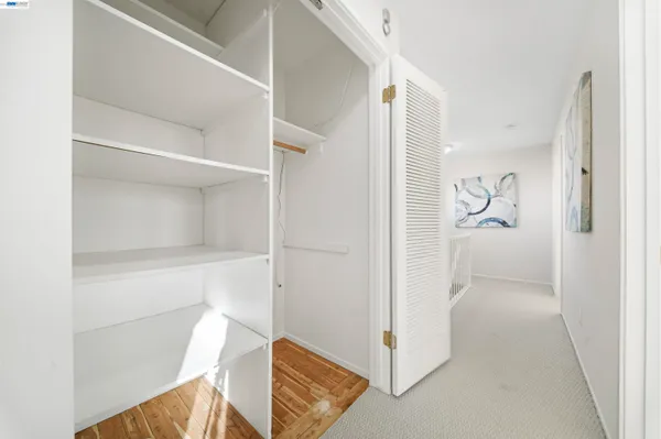 a patio with table and chairs and garden