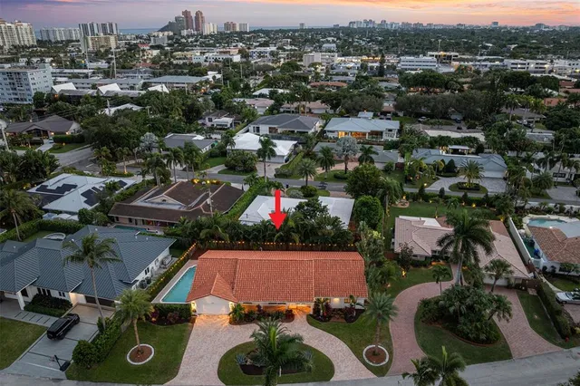 an aerial view of a house with yard