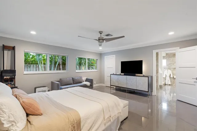 a bathroom with a granite countertop sink a toilet and shower
