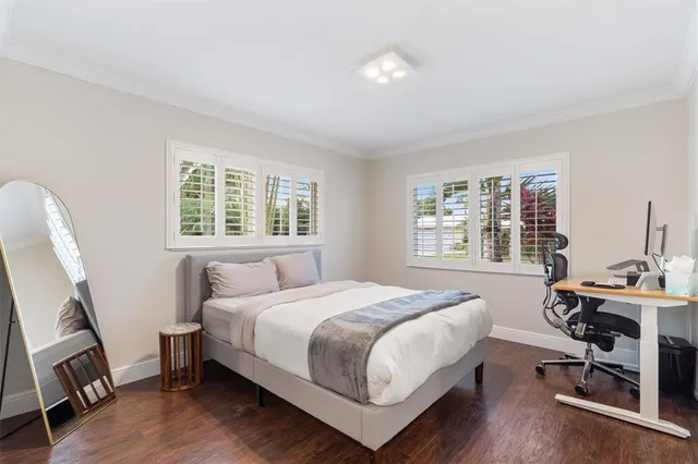a white toilet sitting next to a bathroom sink