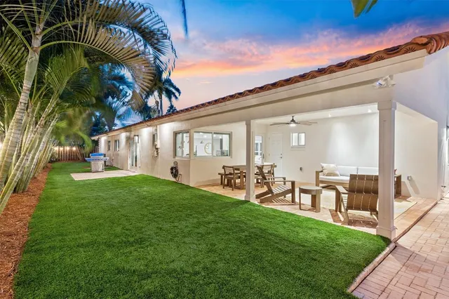 a couple of table and chairs in the yard