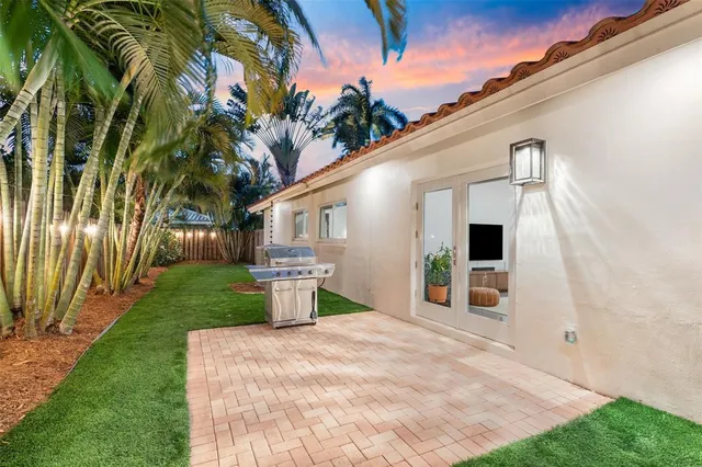 a view of a back yard with a house