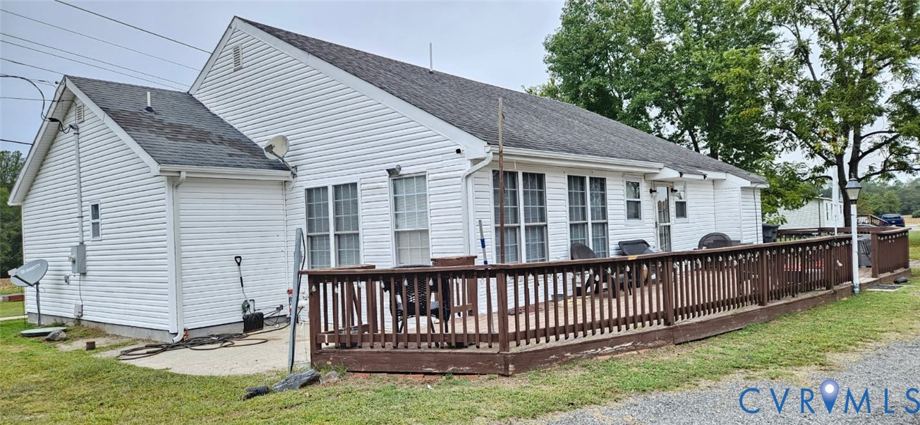 1025 Sunnyside Road Tappahannock, VA 22560 - Photo 2 of 6 a view of a house with a yard