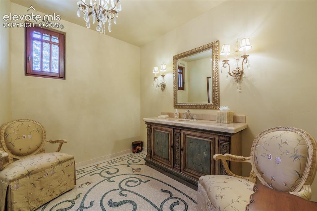 4530 Governors Point Colorado Springs, CO 80906 - Photo 10 of 49 Mosaic inset in the "hers" guest bathroom off the foyer