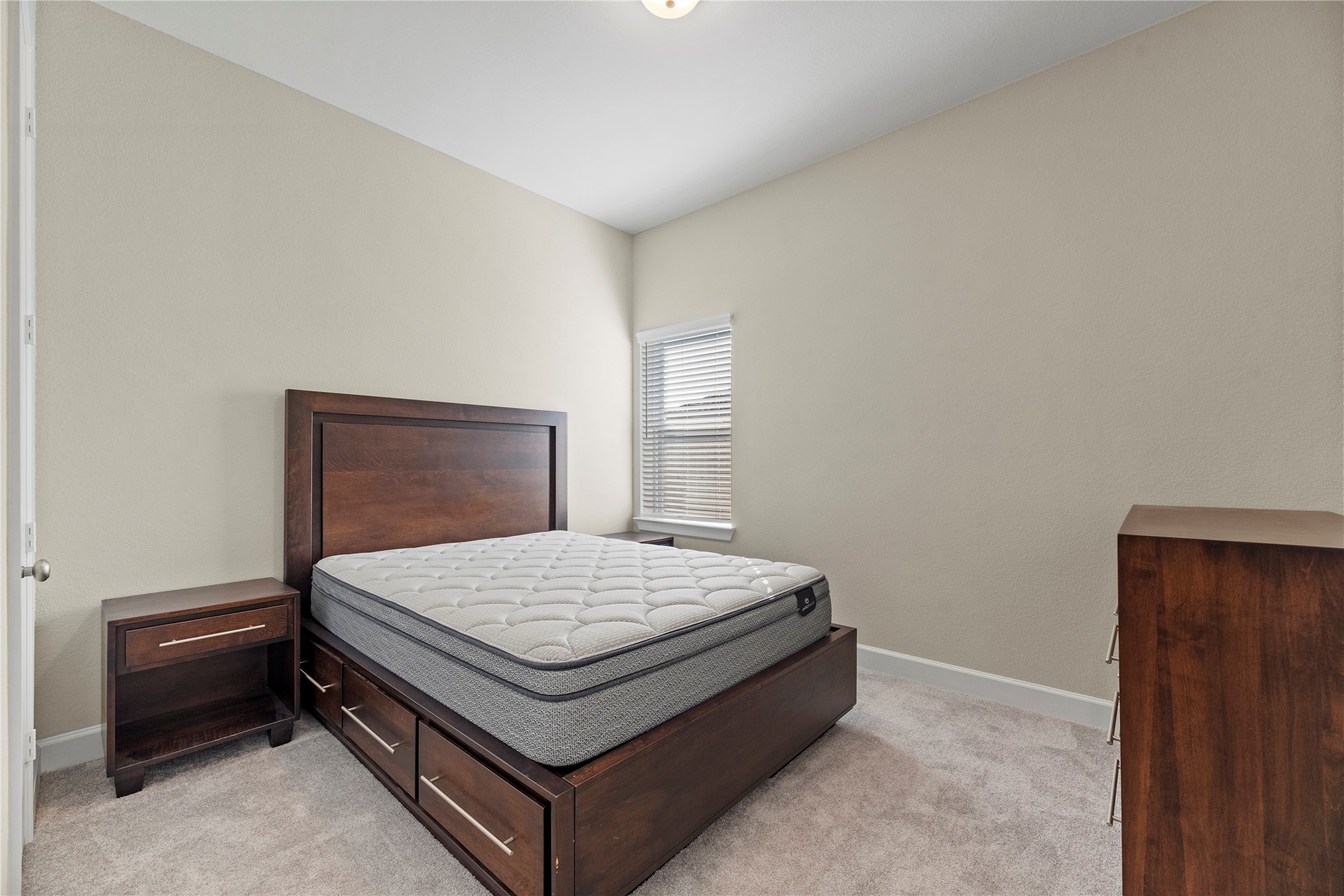 3111 Swift Way Katy, TX 77493 - Photo 16 of 50 a room with a bed and a dresser