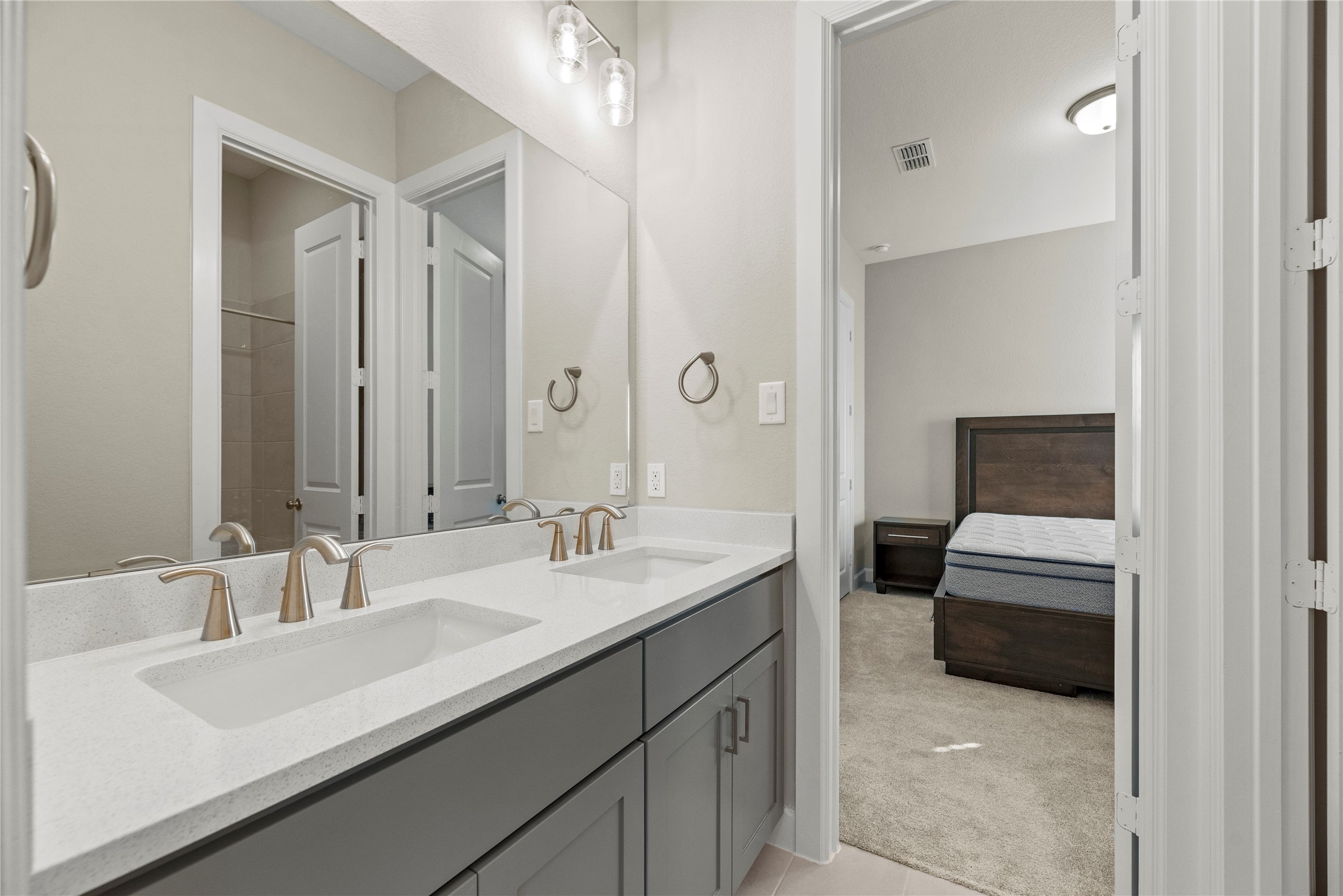 3111 Swift Way Katy, TX 77493 - Photo 18 of 50 a en suite bathroom with a double vanity sink and mirror