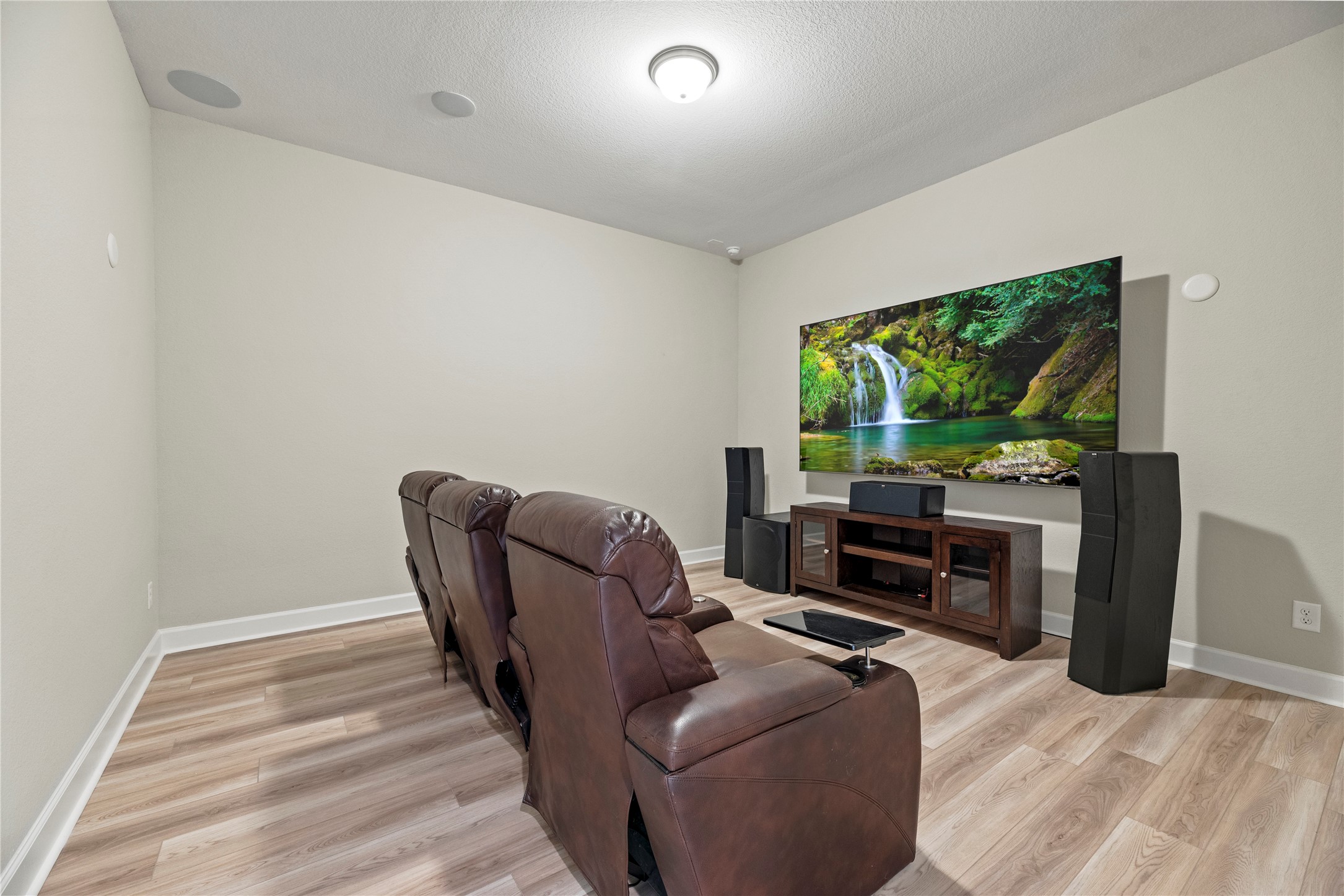 3111 Swift Way Katy, TX 77493 - Photo 20 of 50 a living room with furniture a flat screen tv and a fireplace