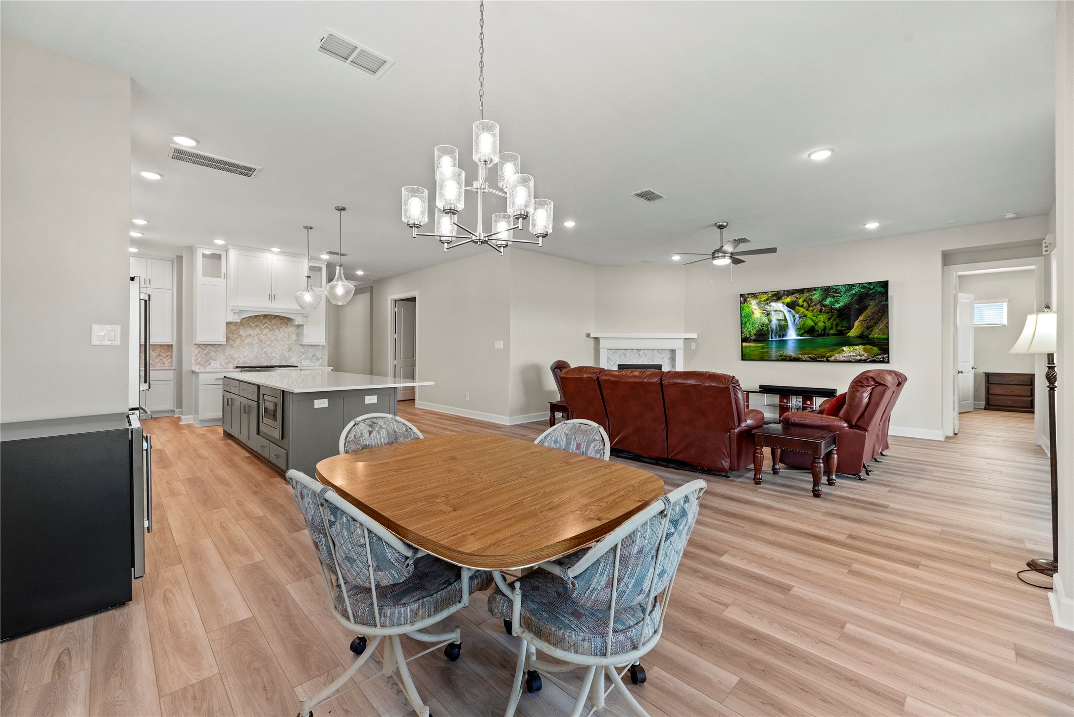 3111 Swift Way Katy, TX 77493 - Photo 32 of 50 a view of a dining room with furniture and wooden floor