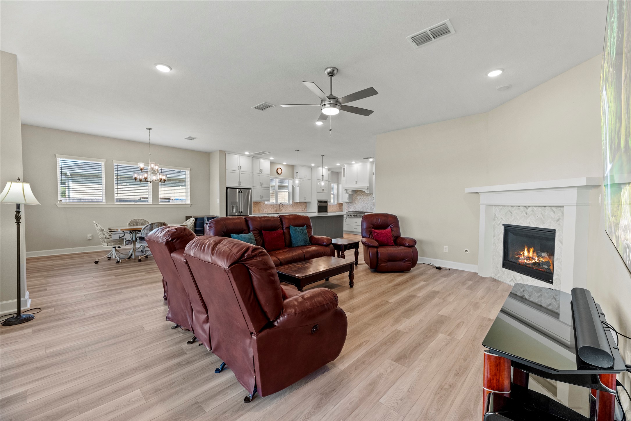 3111 Swift Way Katy, TX 77493 - Photo 35 of 50 a living room with furniture fireplace and wooden floor
