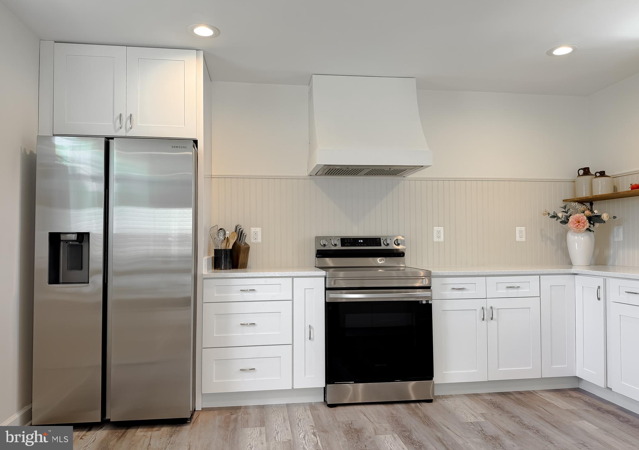 4985 Solomons Island Road Huntingtown, MD 20639 - Photo 10 of 50 a kitchen with cabinets and stainless steel appliances