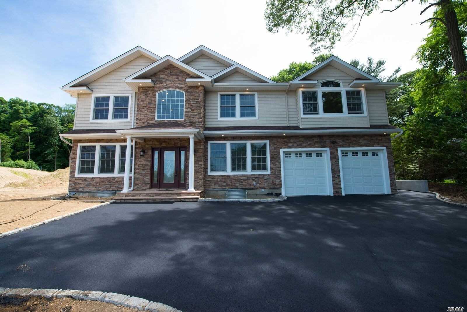 31 Hillside Lane Syosset, NY 11791 - Photo 1 of 1 a front view of a house with a garden