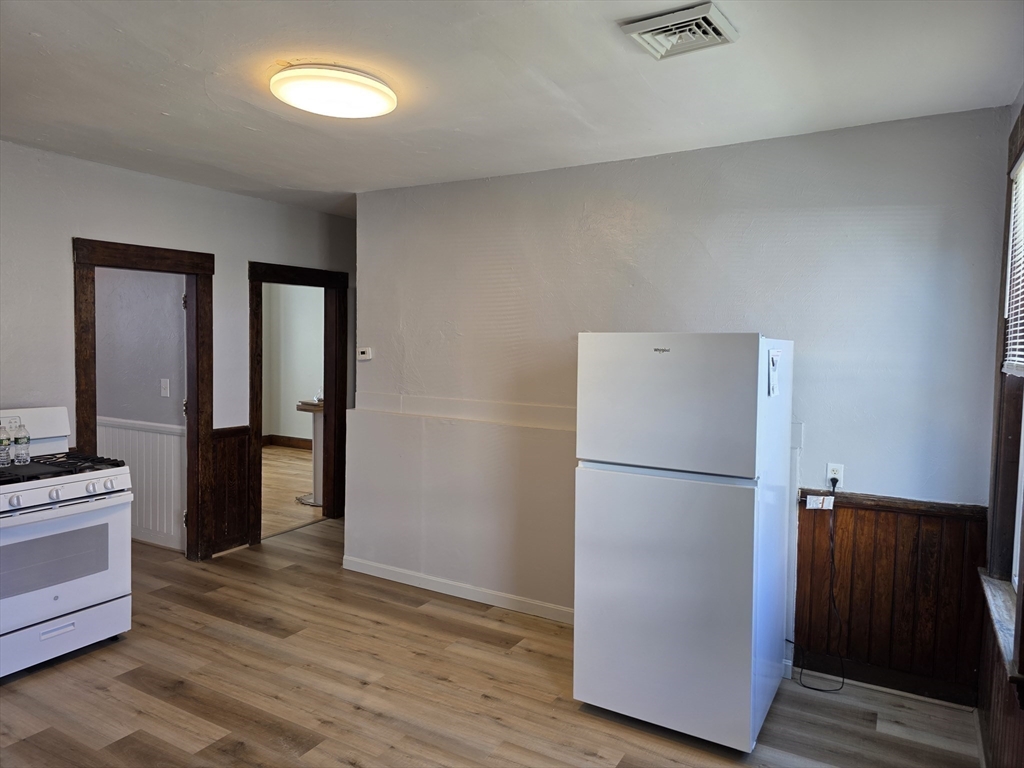2 Hillside Street, Unit 3 Worcester, MA 01610 - Photo 16 of 30 a view of a kitchen with a refrigerator a microwave and a sink