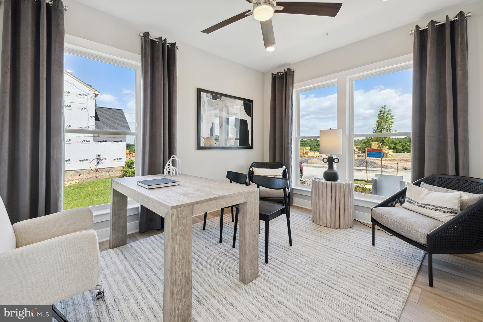 14406 Dowitcher Way, Unit 1 Boyds, MD 20841 - Photo 13 of 50 a living room with furniture and a table
