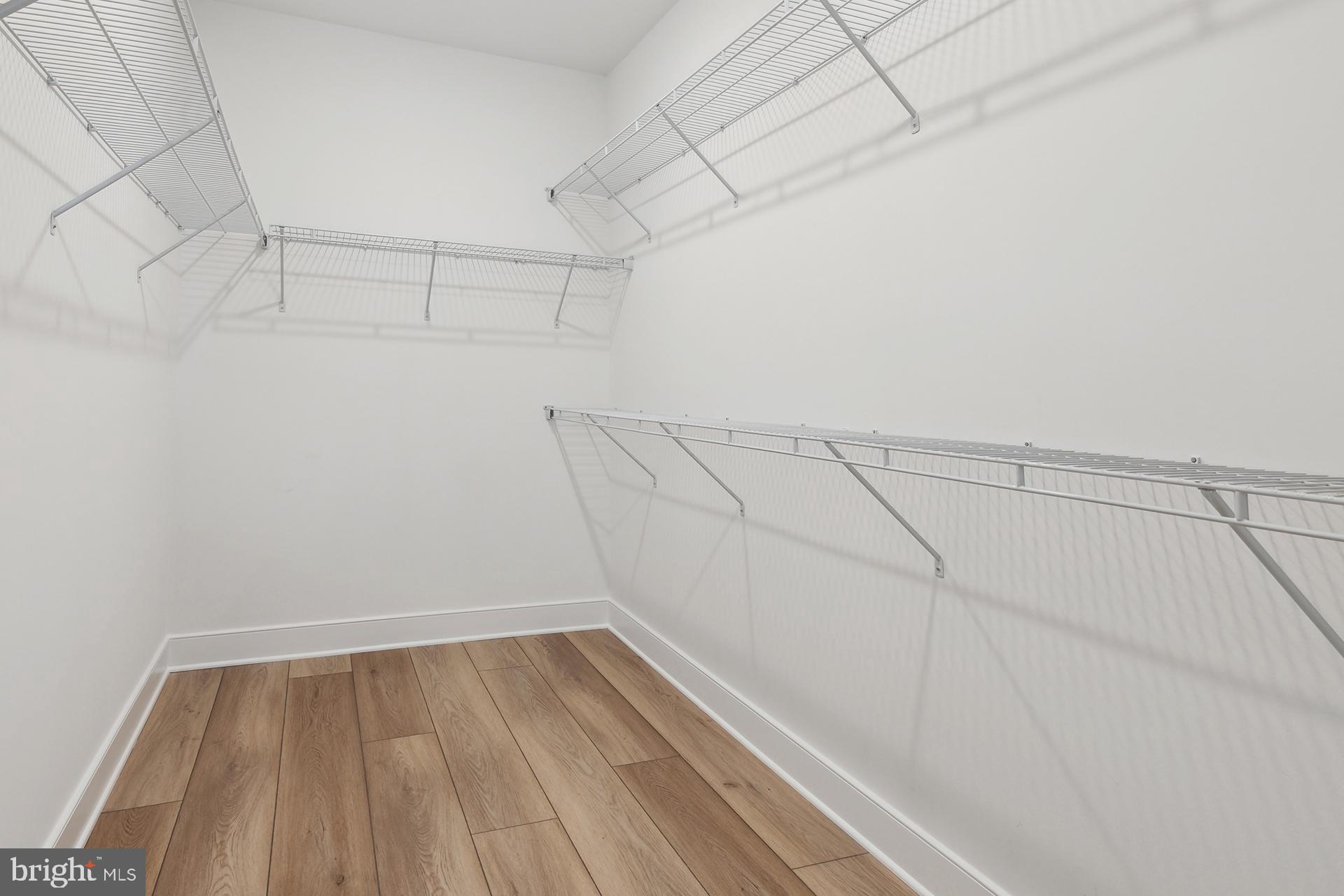 14406 Dowitcher Way, Unit 1 Boyds, MD 20841 - Photo 17 of 50 a view of a room with racks on the wall