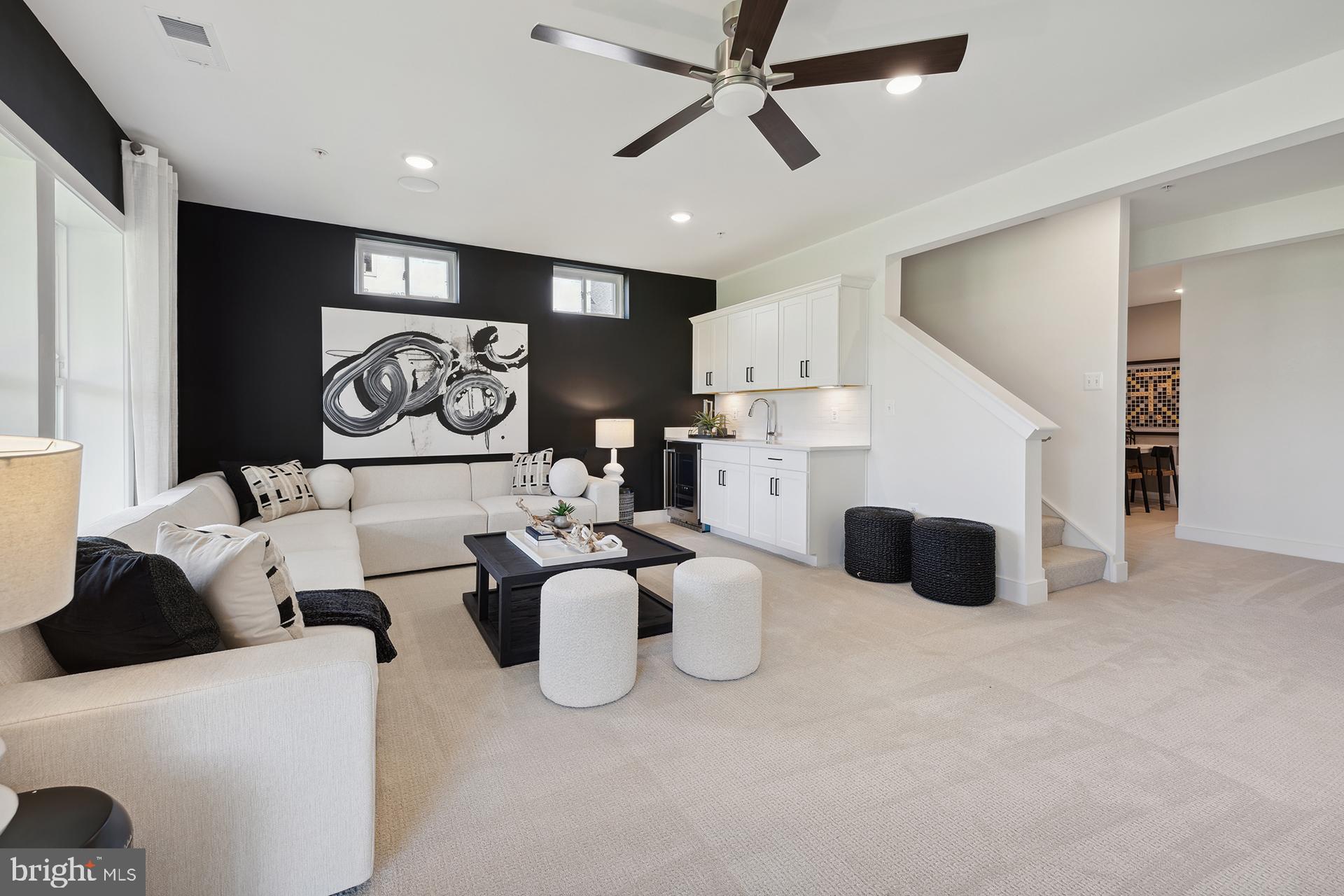 14406 Dowitcher Way, Unit 1 Boyds, MD 20841 - Photo 25 of 50 a living room with furniture and kitchen view