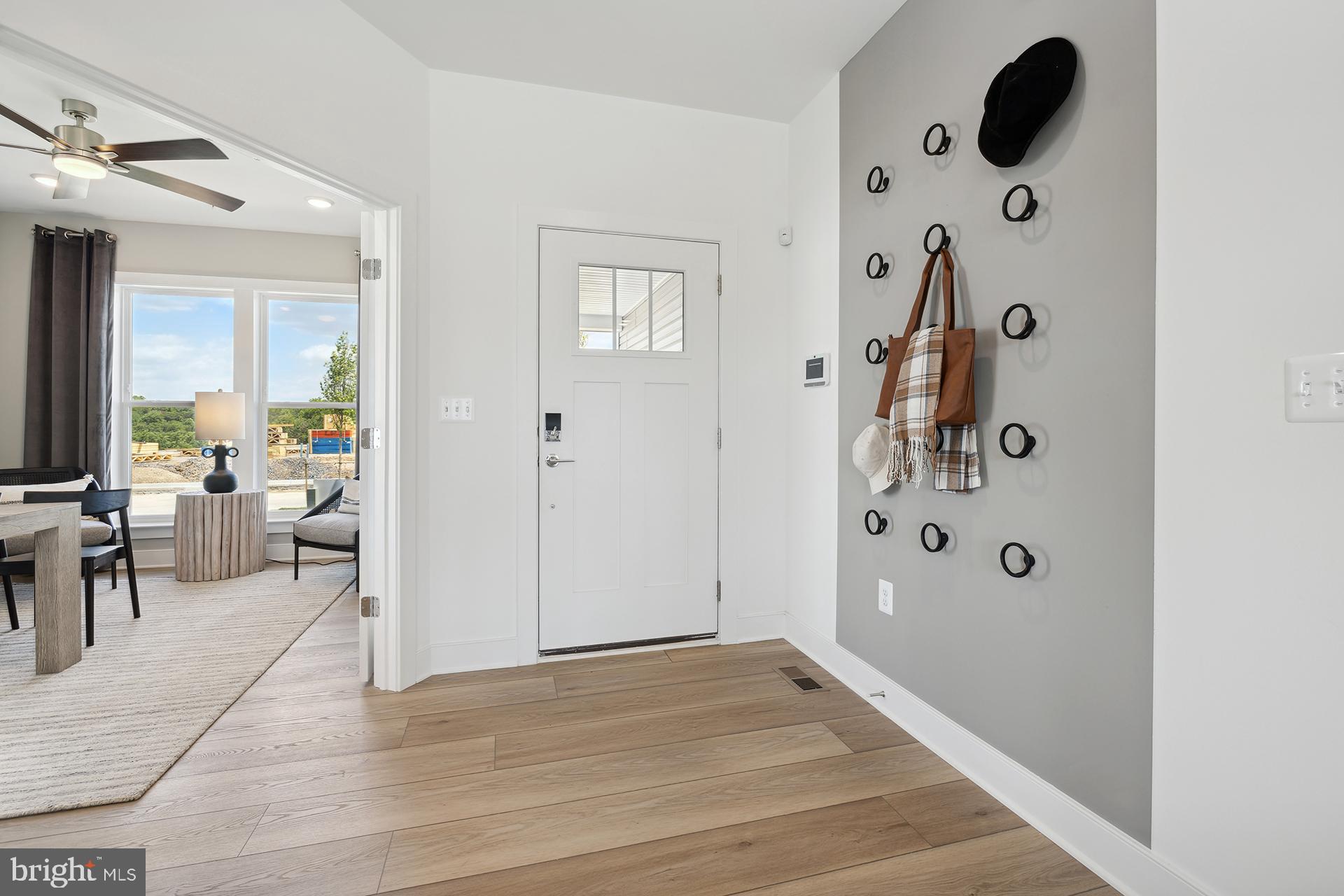 14406 Dowitcher Way, Unit 1 Boyds, MD 20841 - Photo 5 of 50 a view of a livingroom with furniture and windows