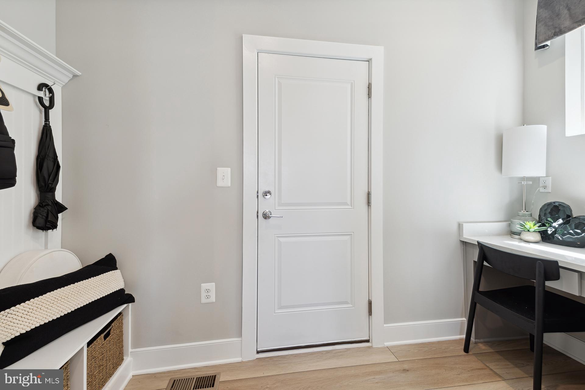 14406 Dowitcher Way, Unit 1 Boyds, MD 20841 - Photo 6 of 50 a view of a workspace with furniture and wooden floor