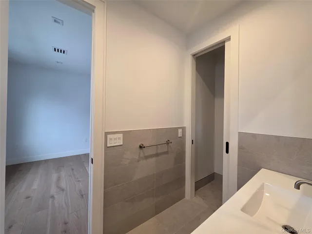 a bathroom with a bathtub and shower