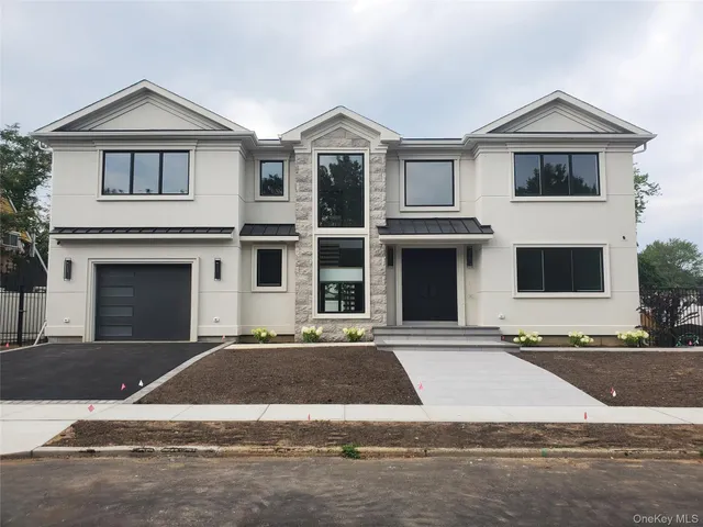 a front view of a house with yard