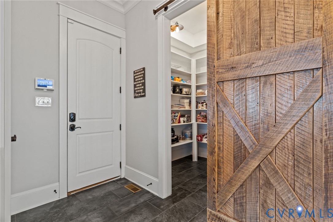 2313 Cheverton Lane Midlothian, VA 23112 - Photo 20 of 62 a view of a hallway with wooden floor and entryway