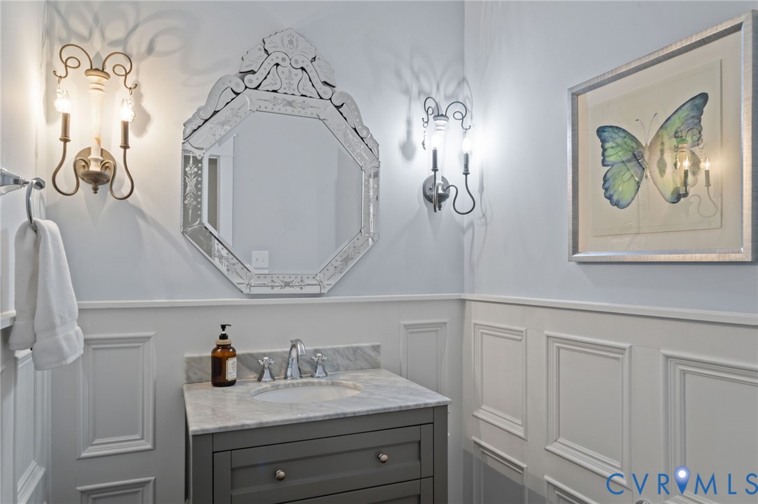 2313 Cheverton Lane Midlothian, VA 23112 - Photo 21 of 62 a bathroom with a sink a mirror and vanity