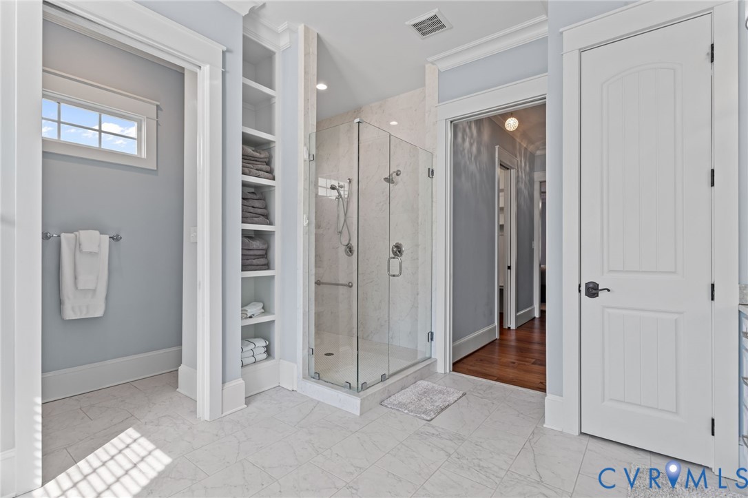 2313 Cheverton Lane Midlothian, VA 23112 - Photo 27 of 62 Luxurious primary bath showcasing a glass-enclosed