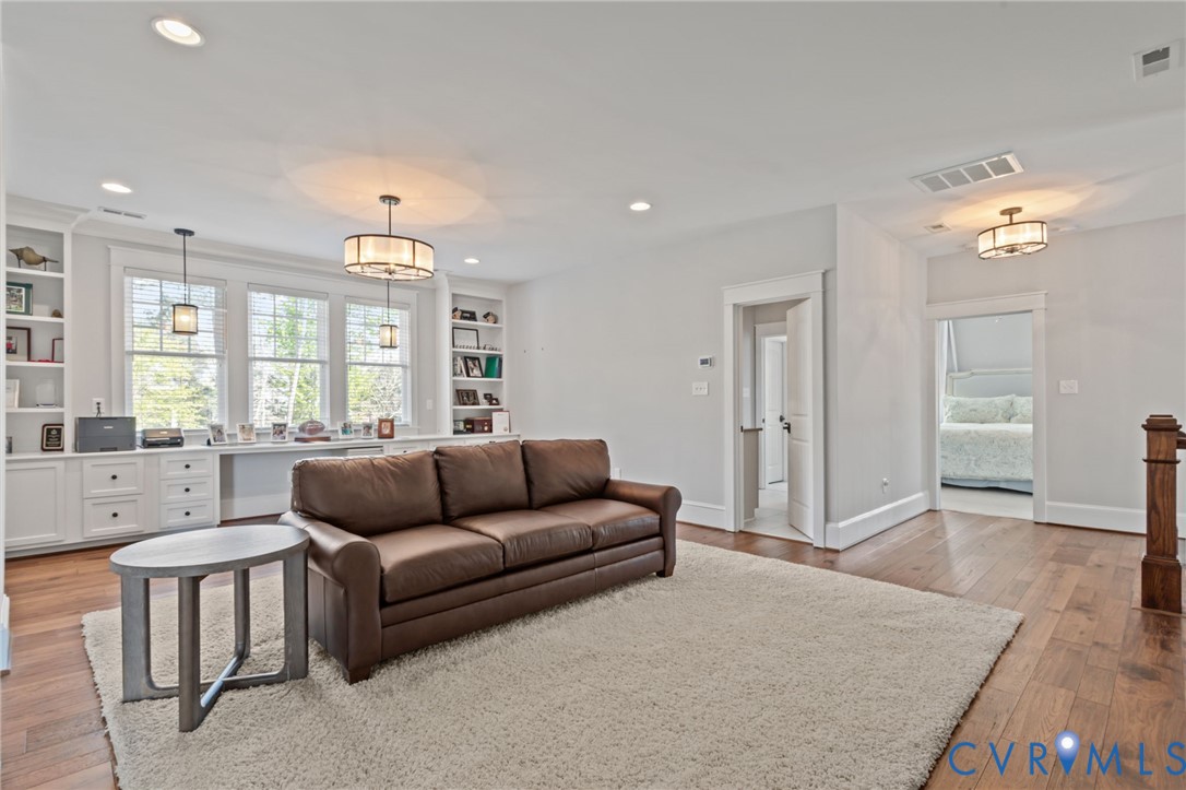 2313 Cheverton Lane Midlothian, VA 23112 - Photo 32 of 62 a living room with furniture and a large window