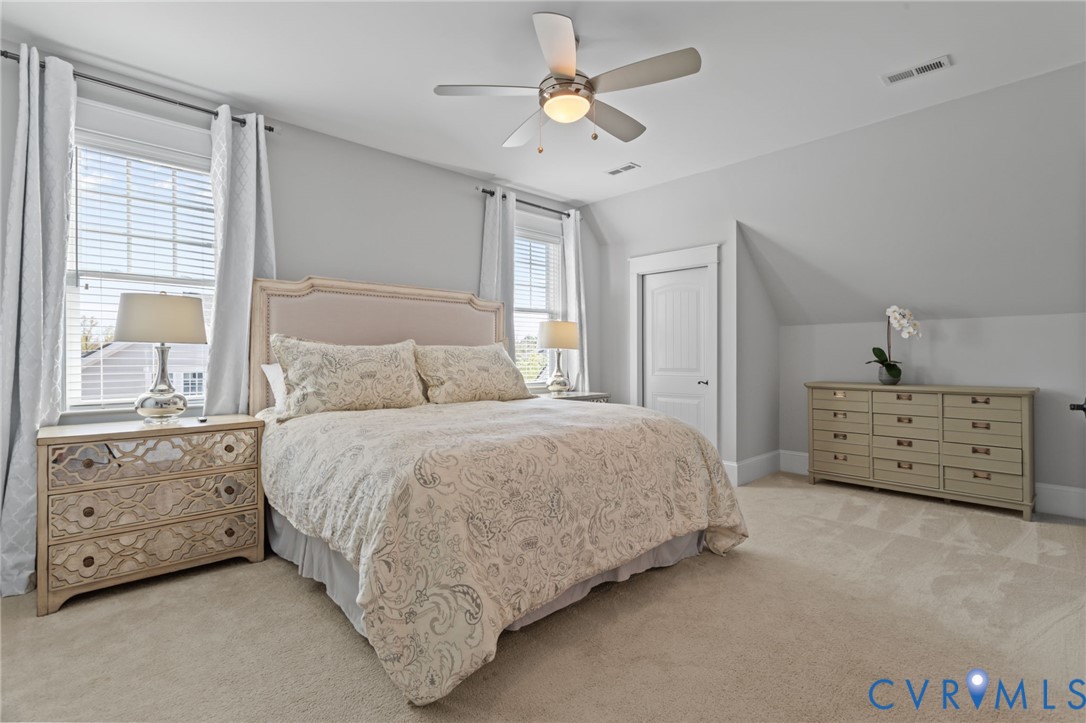 2313 Cheverton Lane Midlothian, VA 23112 - Photo 33 of 62 a bedroom with a bed and a chandelier