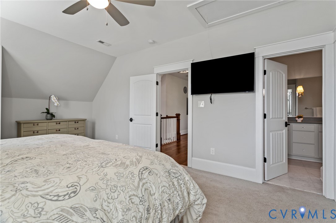 2313 Cheverton Lane Midlothian, VA 23112 - Photo 34 of 62 a bedroom with a bed and a flat screen tv
