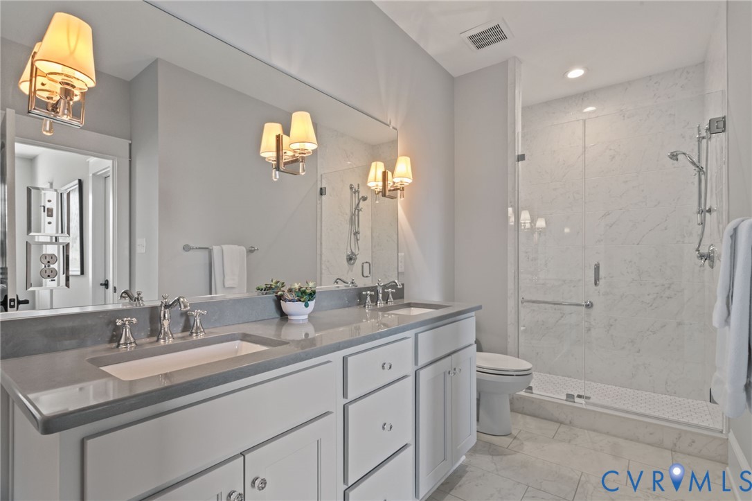 2313 Cheverton Lane Midlothian, VA 23112 - Photo 35 of 62 a bathroom with a granite countertop sink toilet and shower