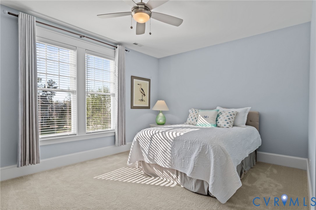 2313 Cheverton Lane Midlothian, VA 23112 - Photo 40 of 62 a spacious bedroom with a bed and a large window