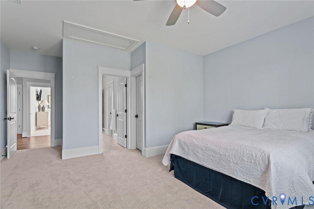 2313 Cheverton Lane Midlothian, VA 23112 - Photo 44 of 62 a bedroom with a bed and a chandelier