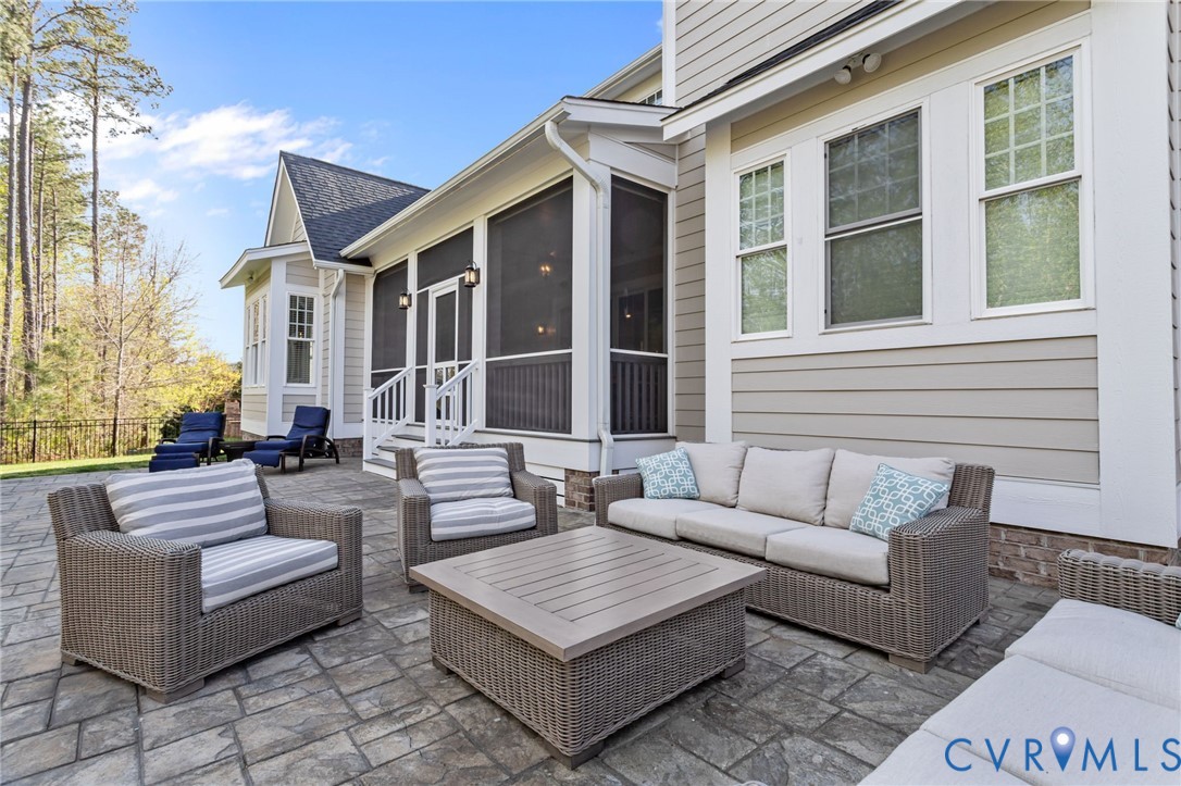 2313 Cheverton Lane Midlothian, VA 23112 - Photo 48 of 62 a view of a patio with couches and a potted plant on a table