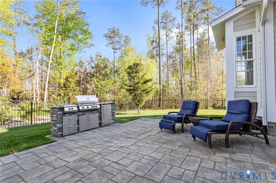 2313 Cheverton Lane Midlothian, VA 23112 - Photo 49 of 62 Expansive paver patio featuring built-in outdoor k