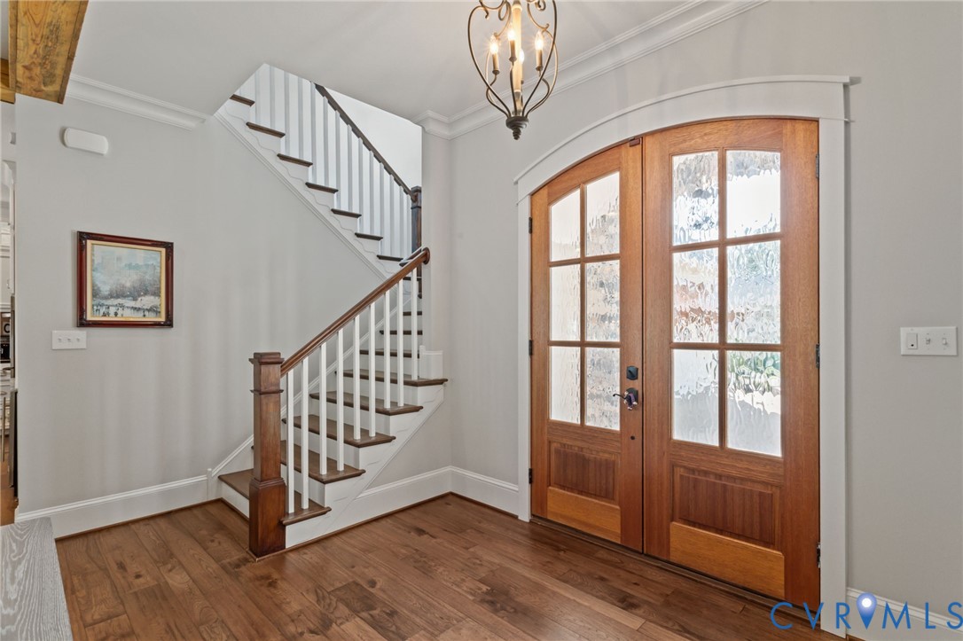 2313 Cheverton Lane Midlothian, VA 23112 - Photo 6 of 62 a view of staircase with wooden floor and windows