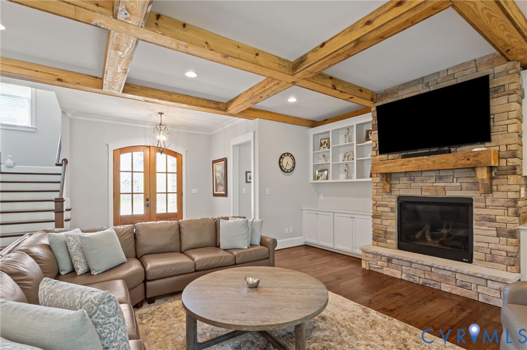 2313 Cheverton Lane Midlothian, VA 23112 - Photo 7 of 62 a living room with furniture a flat screen tv and a fireplace