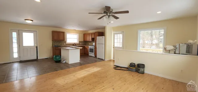 a kitchen with granite countertop a sink and a stove top oven