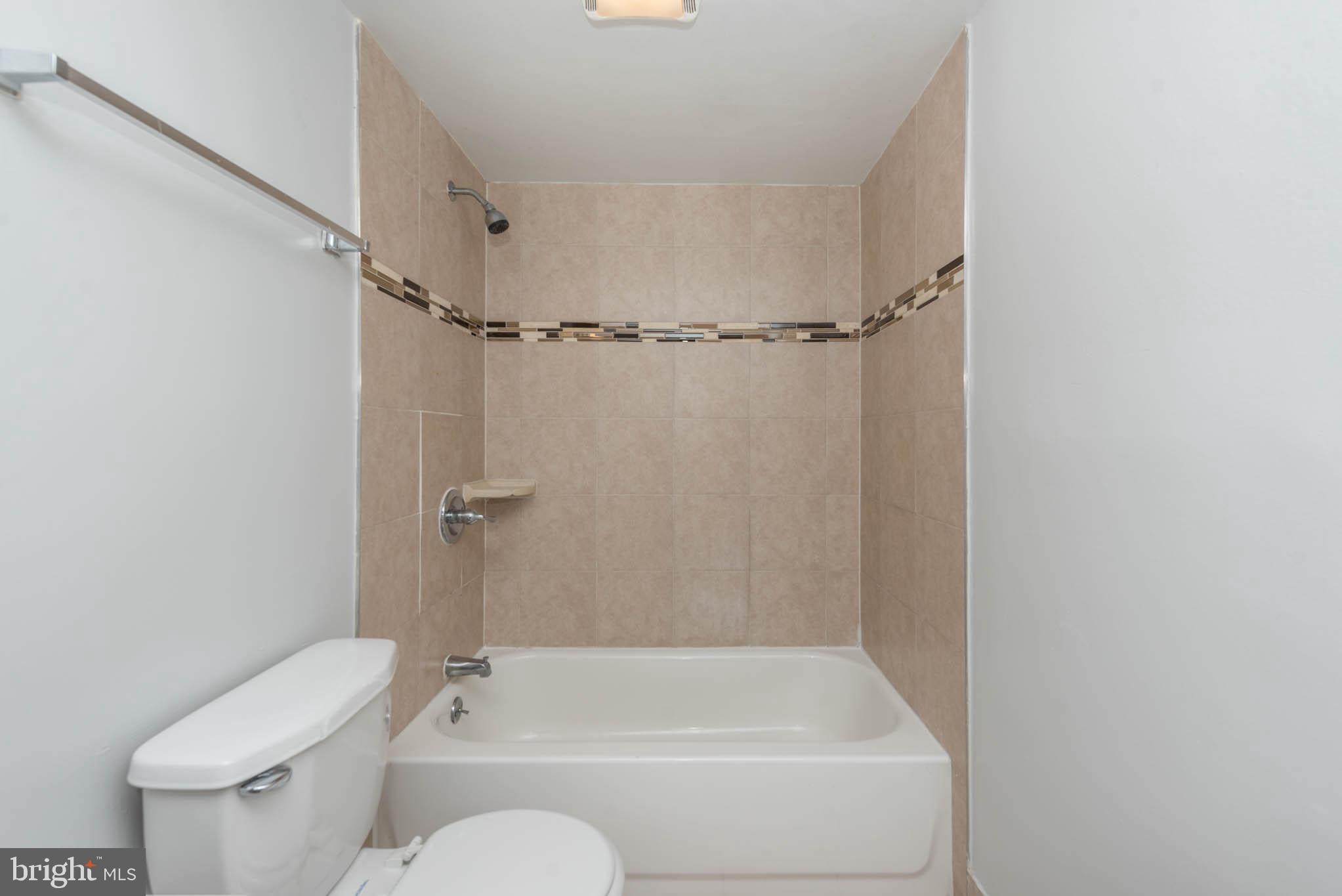 1911 West Baltimore Street Baltimore, MD 21223 - Photo 12 of 32 a bathroom with a shower and toilet