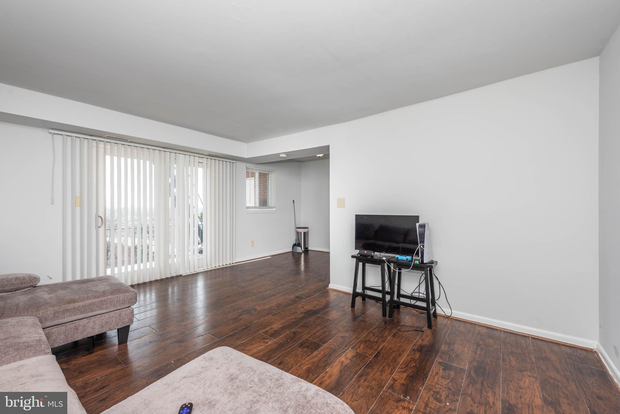 1911 West Baltimore Street Baltimore, MD 21223 - Photo 13 of 32 a view of a livingroom with wooden floor and furniture