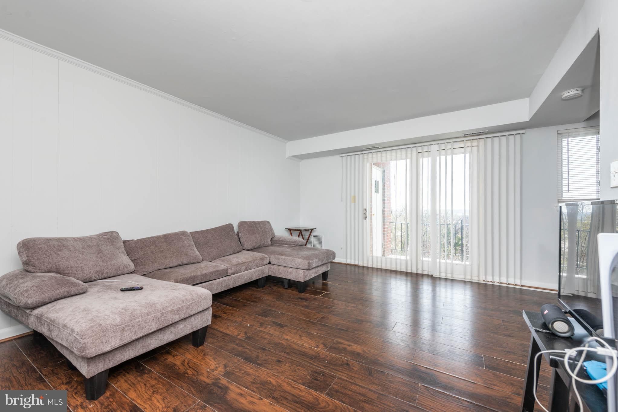 1911 West Baltimore Street Baltimore, MD 21223 - Photo 14 of 32 a living room with furniture and a large window