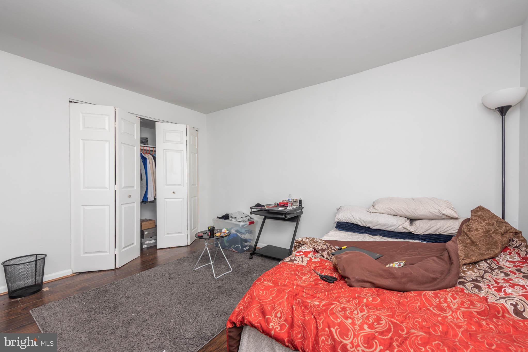 1911 West Baltimore Street Baltimore, MD 21223 - Photo 20 of 32 a bedroom with a bed and chair