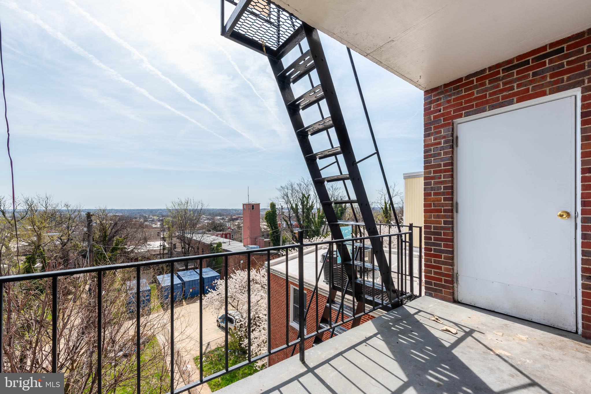 1911 West Baltimore Street Baltimore, MD 21223 - Photo 25 of 32 a view of staircase with railing and stairs
