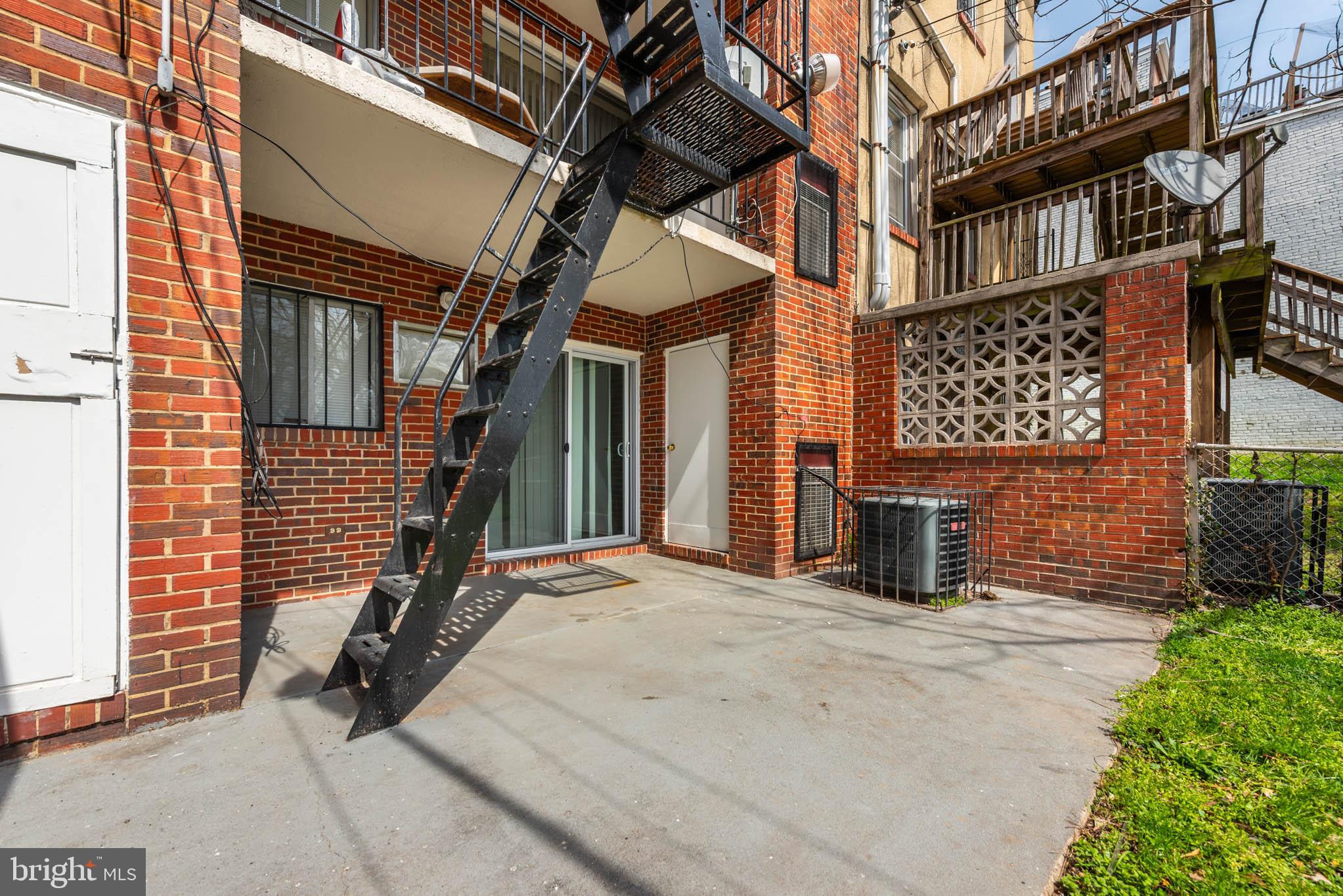 1911 West Baltimore Street Baltimore, MD 21223 - Photo 29 of 32 a view of a brick house with many windows