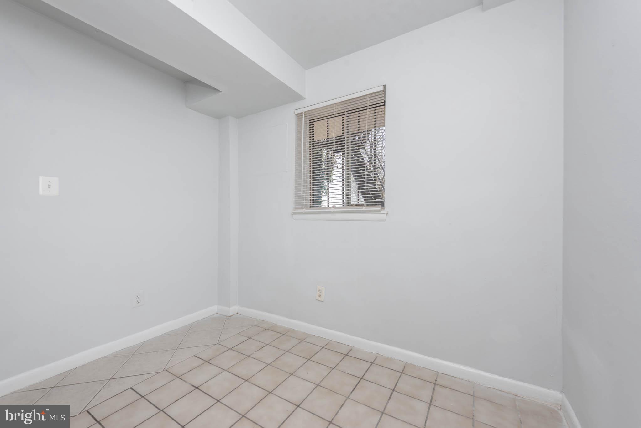 1911 West Baltimore Street Baltimore, MD 21223 - Photo 9 of 32 a view of an empty room with windows