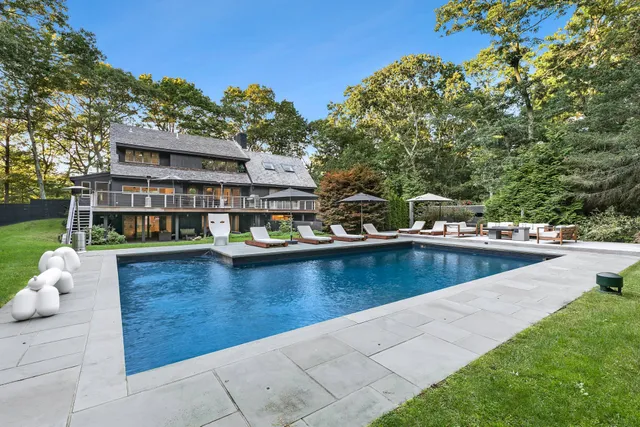 a view of a swimming pool with lounge chair