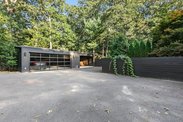 a view of a house with a yard and garage