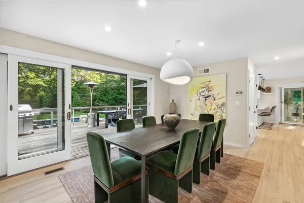 a view of a dining room with furniture window and outside view